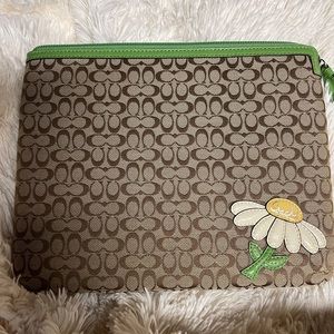 Coach iPad sleeve with zipper closure.